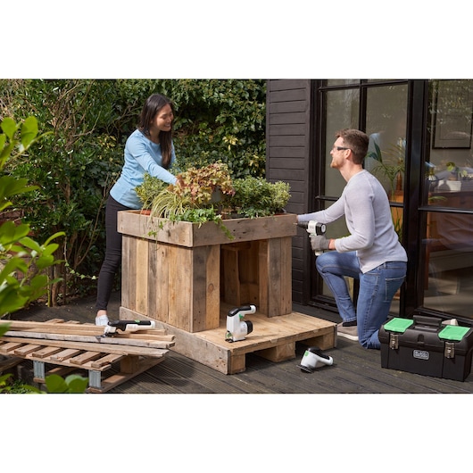 Photo of BLACKDECKER BDST60120 power tools and black toolbox used for outdoor woodworking project.