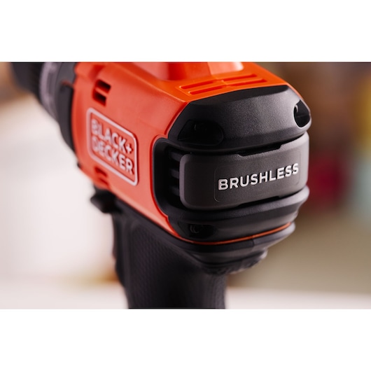 Close-up of BLACK+DECKER BLD682D1 brushless drill, orange and black colors, product photography.