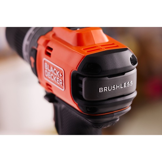 Close-up photo of BLACK+DECKER BLD683XN cordless brushless drill, showing orange and black housing with logo.
