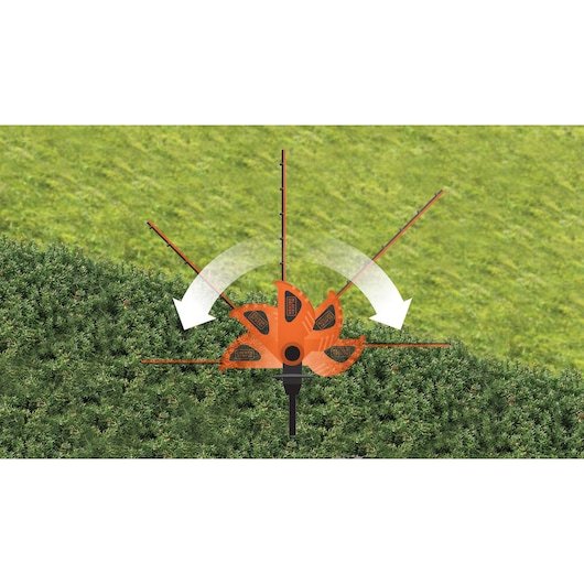 BLACKDECKER GTC1843L hedge trimmer demonstrating adjustable cutting head positions on green hedge, top view.