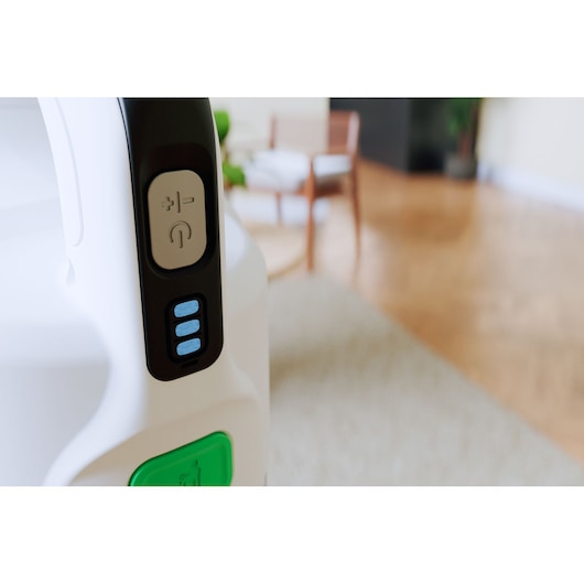 BLACKDECKER REVSV18D1 vacuum cleaner close-up of handle controls and battery indicator indoors.