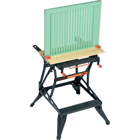 A BLACK+DECKER Workmate 550 portable workbench with a green slatted wooden panel clamped in place, suitable for use in woodworking and DIY projects.